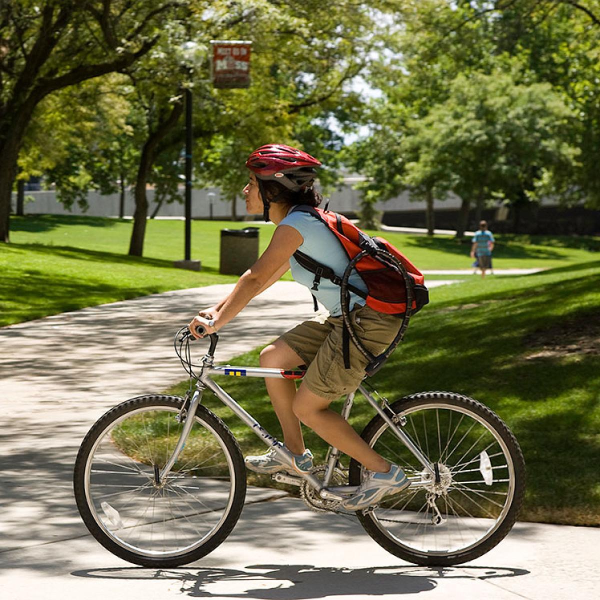 Student on a bike rides across U of U campus.