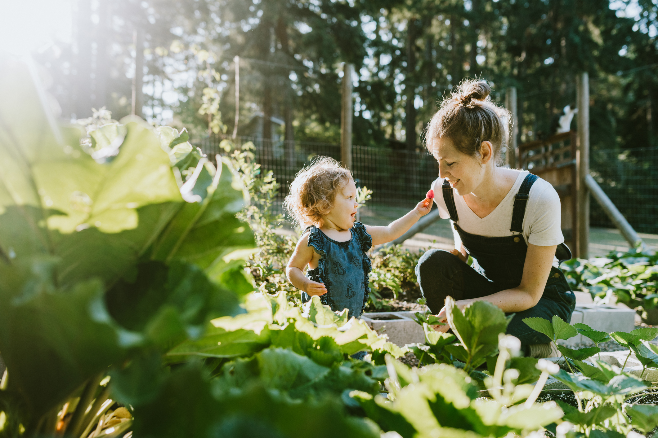 White woman and child in garden