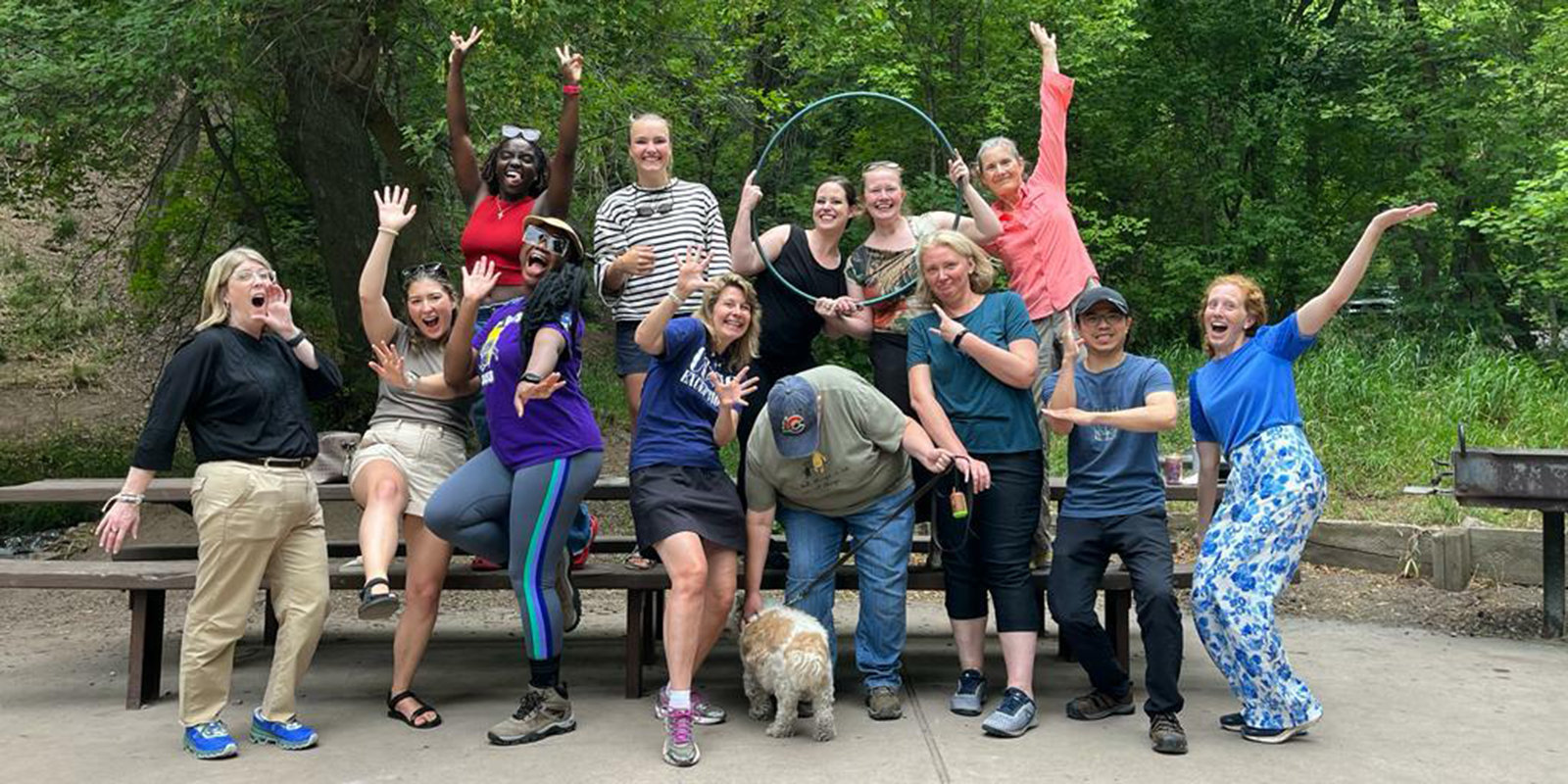 Ulrich Group members at a park striking a pose as they take a group photo