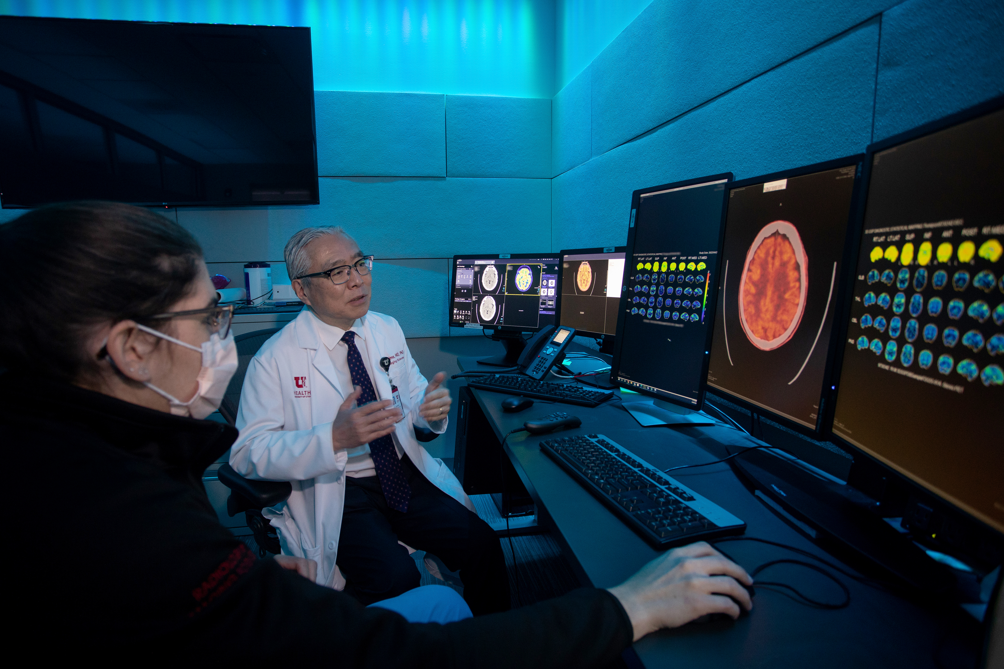 Satoshi Minoshima, MD, examines a brain image in the radiology reading room.