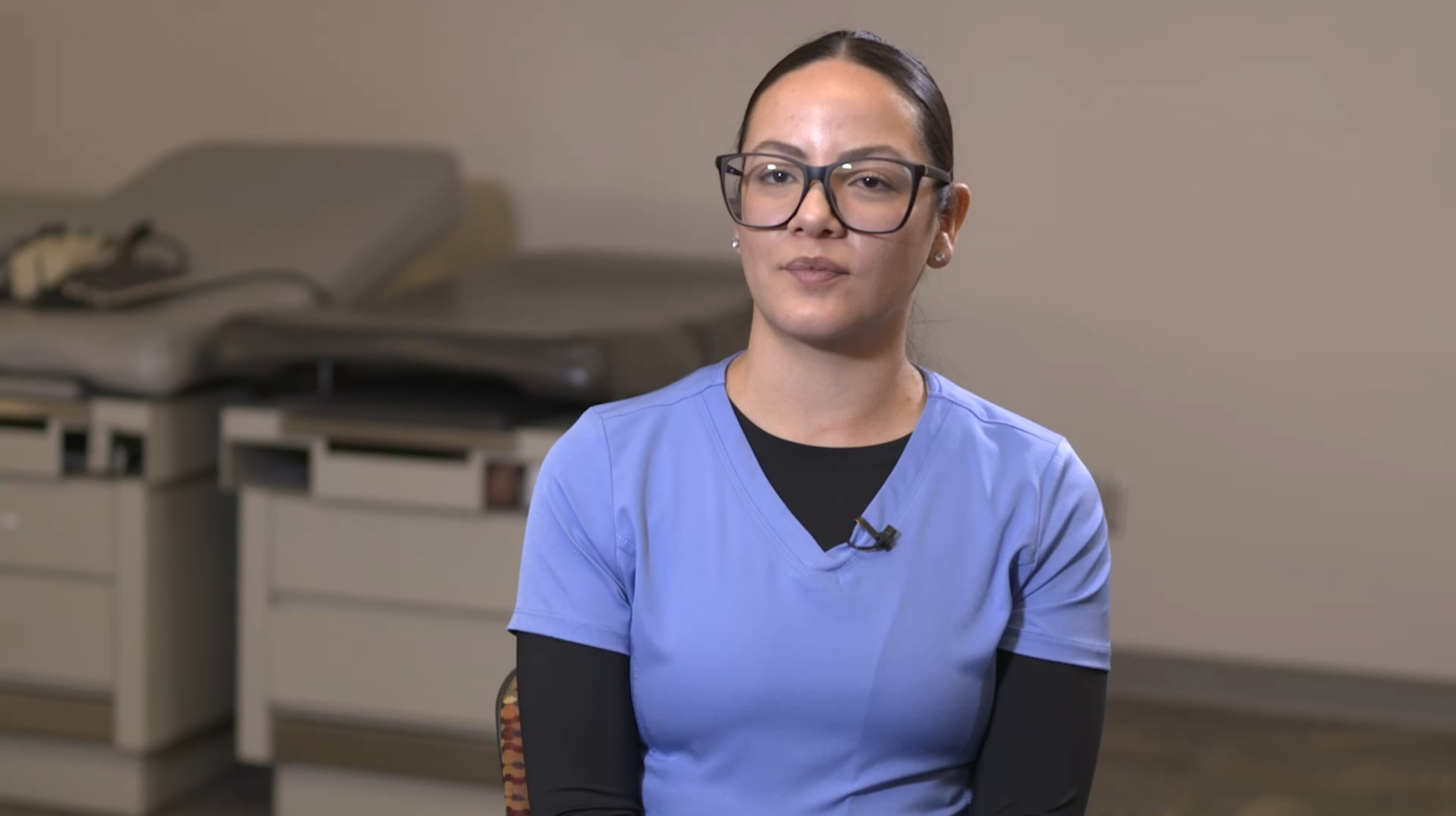 Jasmine in clinical setting being interviewed