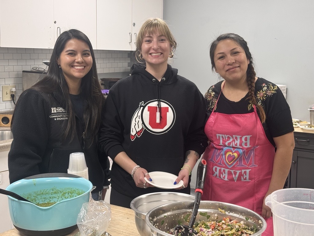 Three individuals in the Bee Strong cooking class