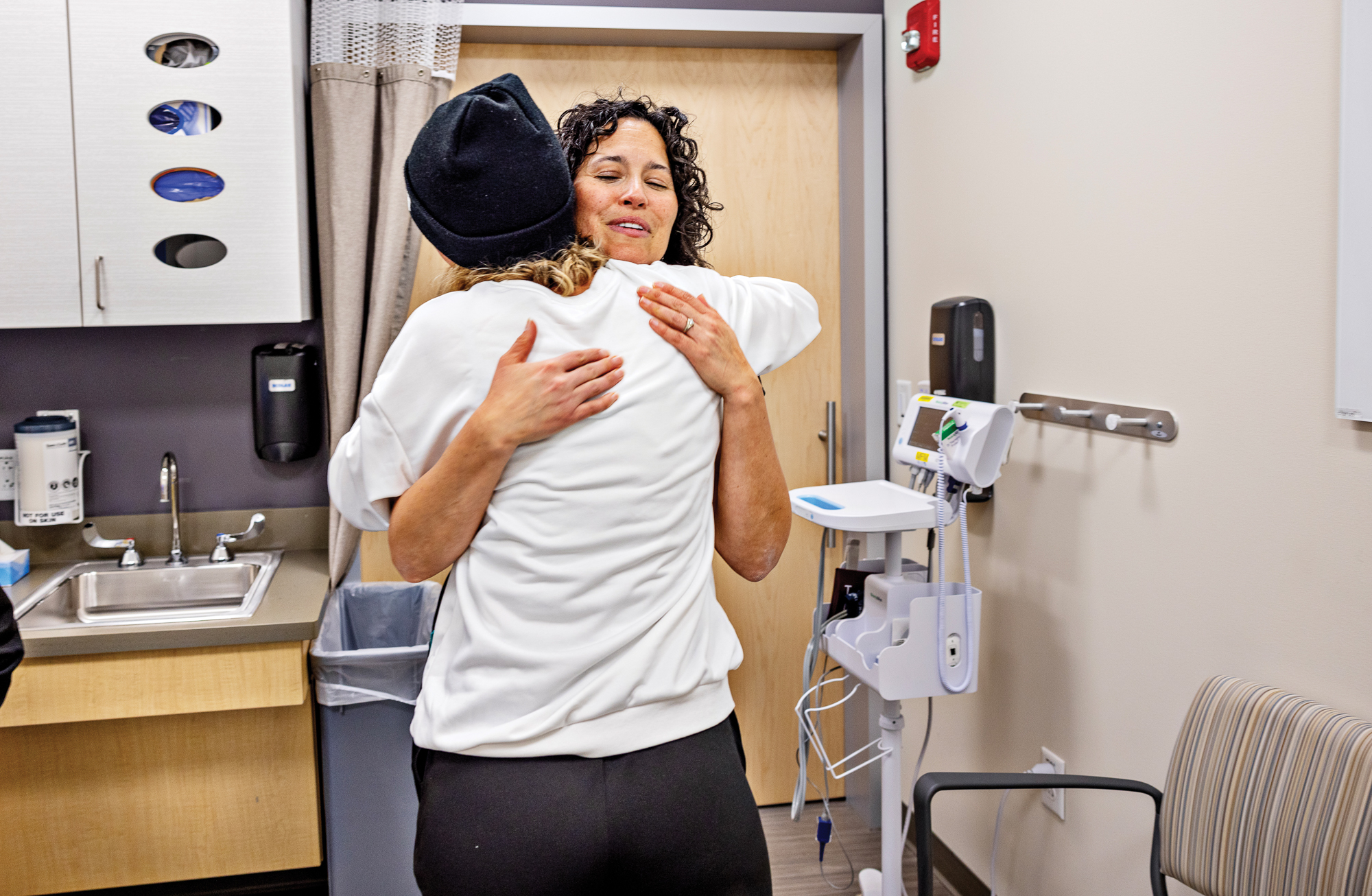 two humans hugging