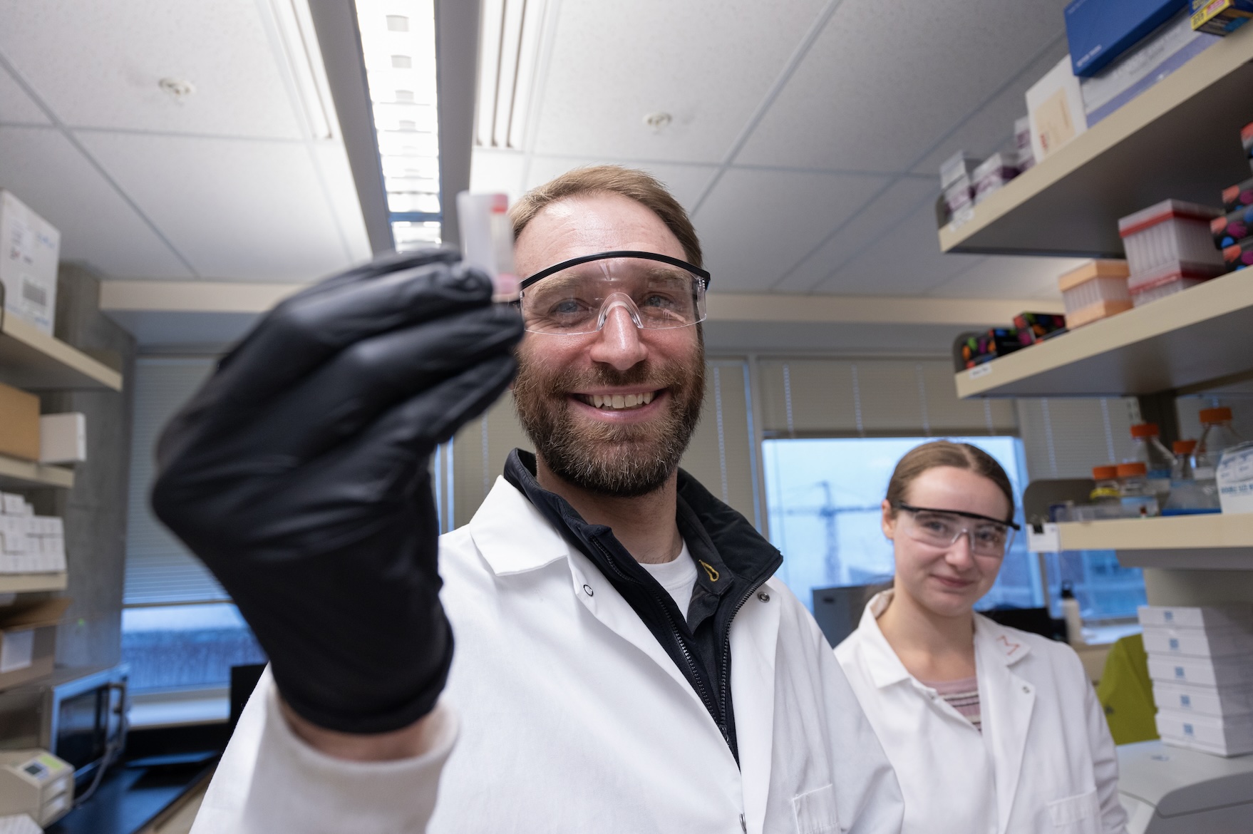 Kevin Hicks in his research lab with colleague.