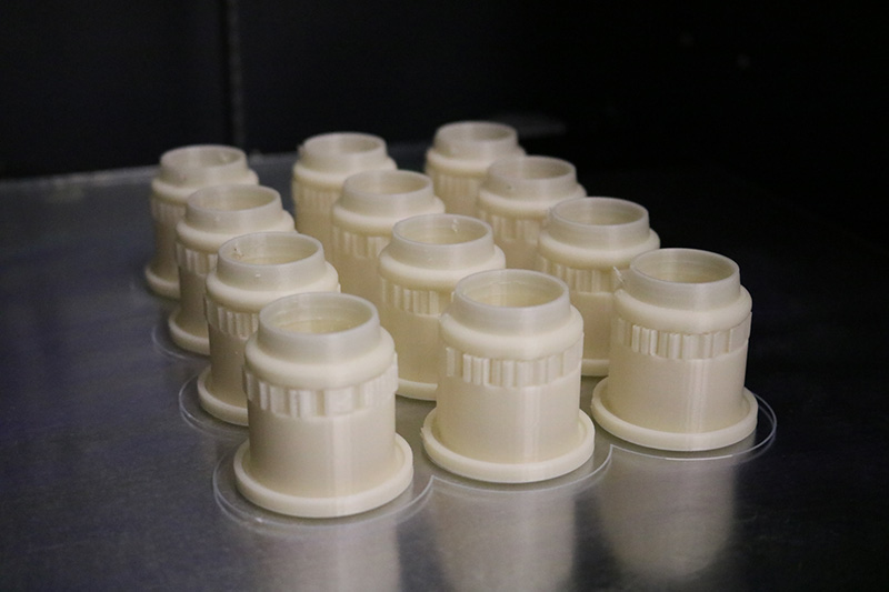 3D printed PAPR adapters on printing bed