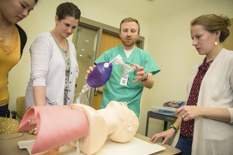 health science students with human mannequin