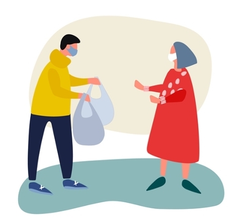Community volunteer helping elderly woman with shopping