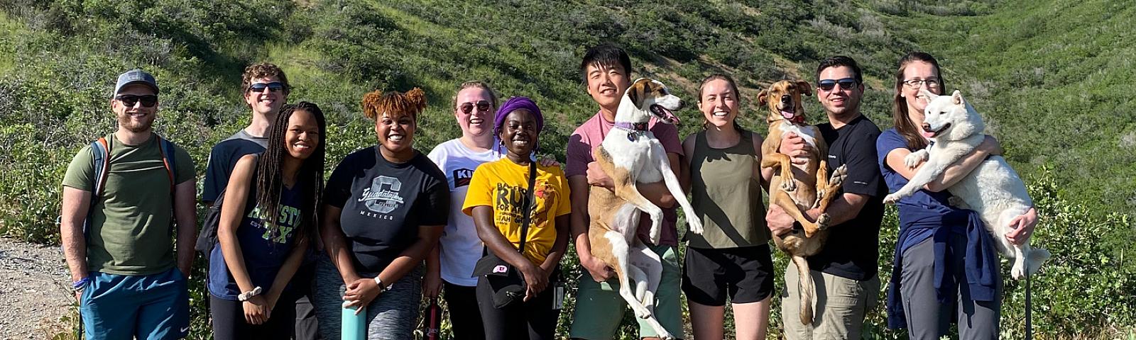 Group photo of Snyder Lab members standing on a trail in the mountains