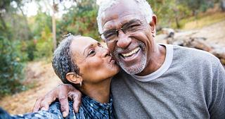 Older Couple Smiling and Kissing