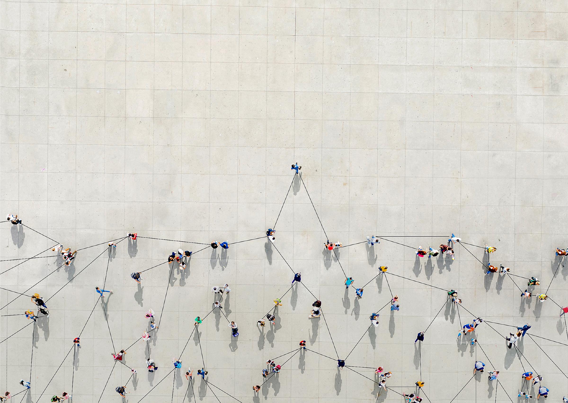 Aerial view of a crowd of people connected by lines