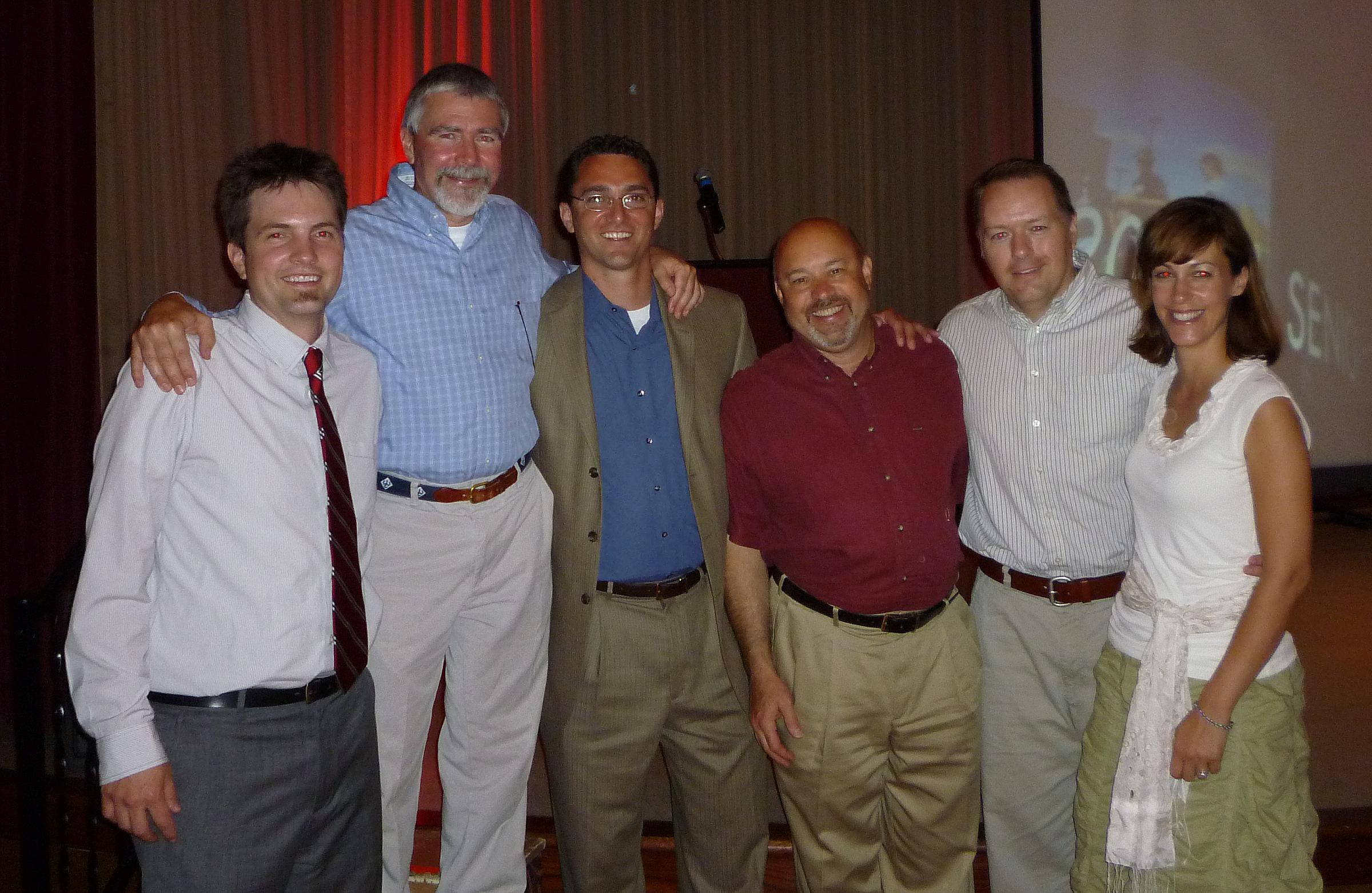 Adam Sharp at emergency medicine residency graduation with program directors and mentors.