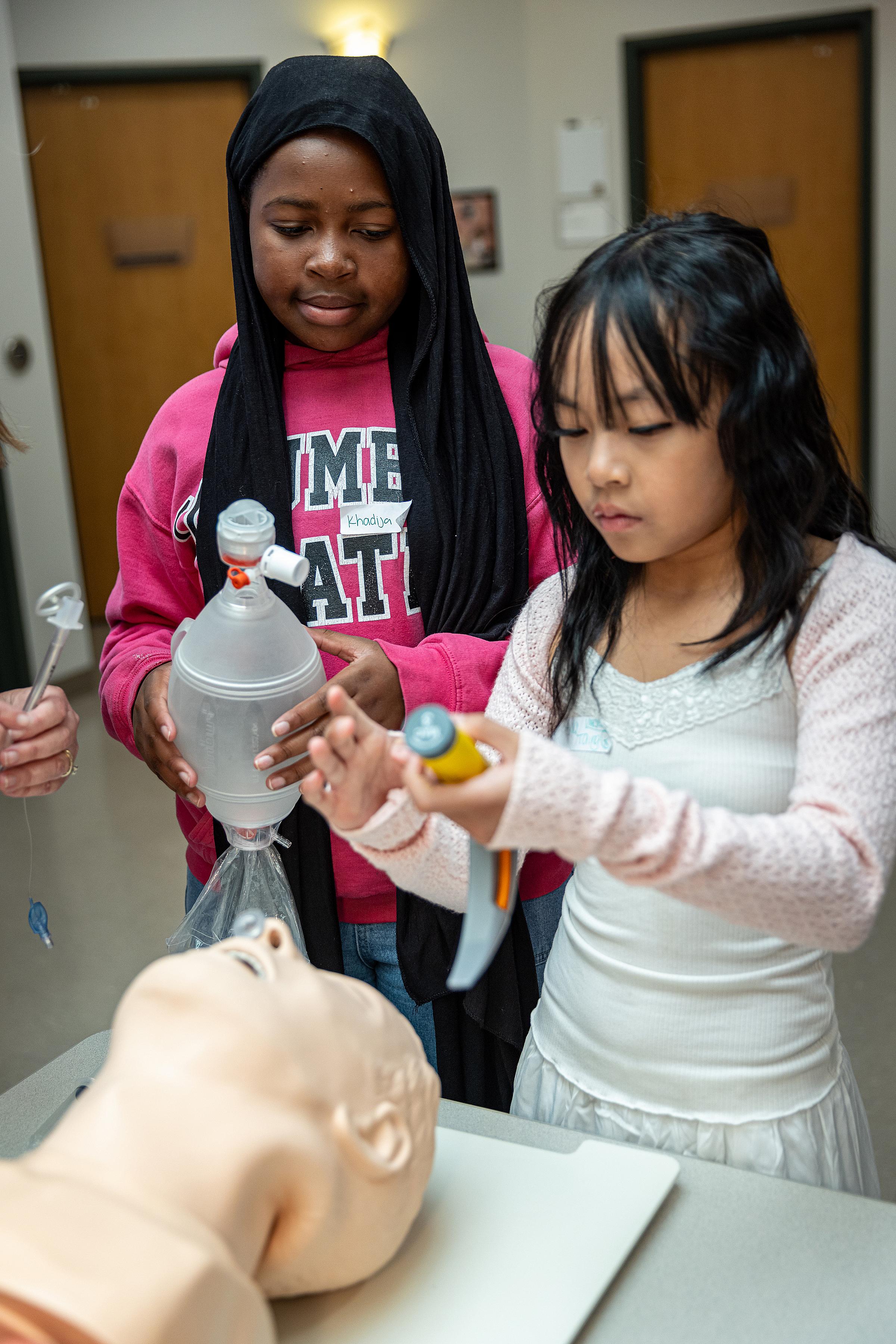 Elementary school students learning about intubation at Imagine U Day. 