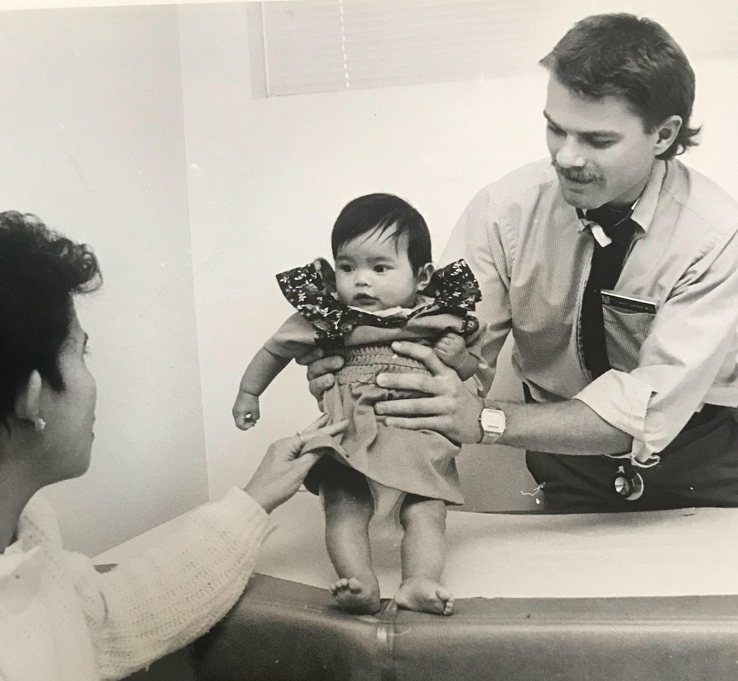 Osman Sanyer, MD, performs well child checkup at Copperview Community Health Center in Midvale, Utah, 1987.