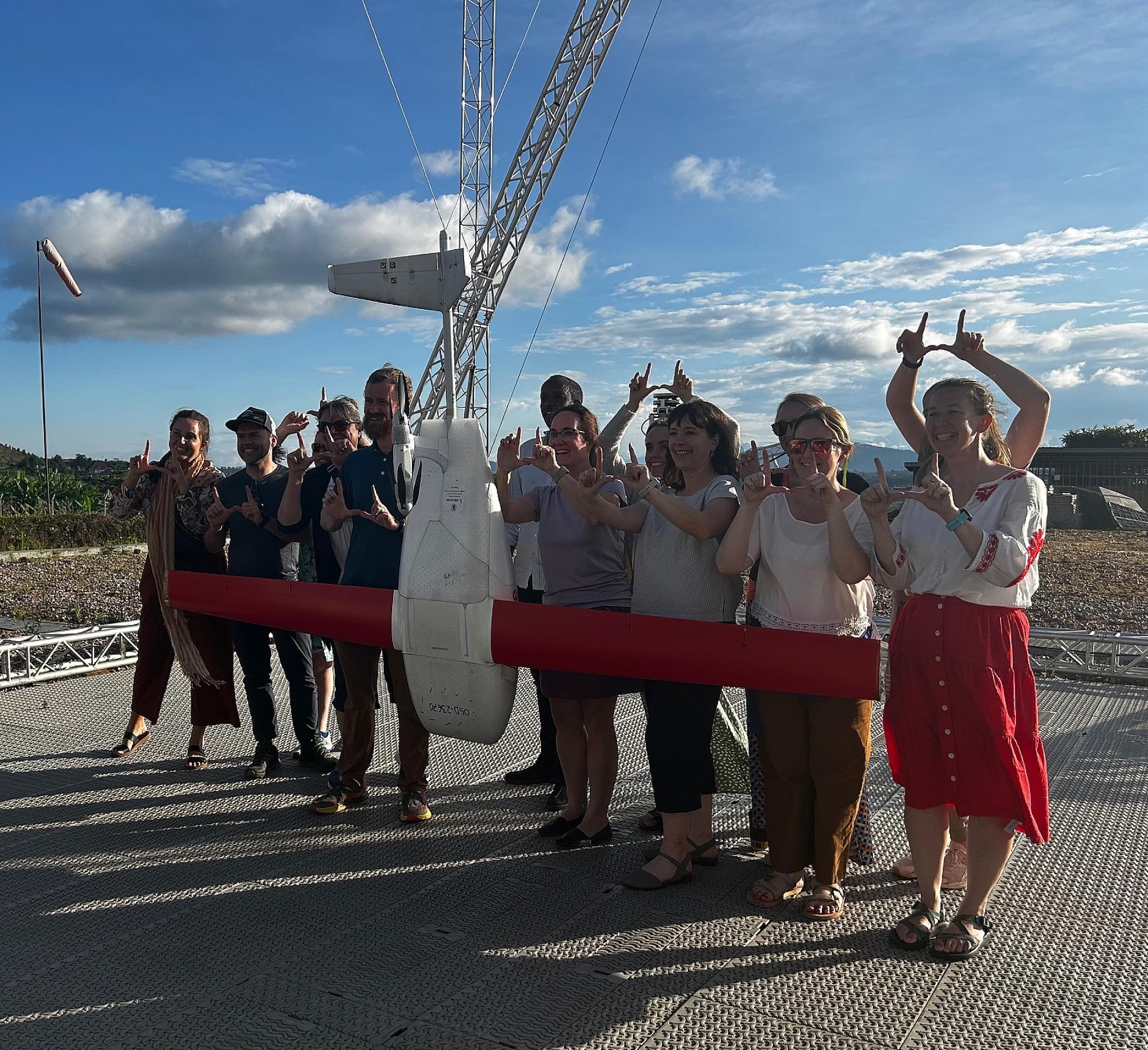 University of Utah nursing students and faculty pose for a photo with the zipline drone that delivers blood, medications, and vaccines to outlying hospitals in Muhanga, Rwanda.