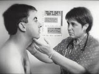 Kristen Reis, MD, treating an AIDS patient in the 1980s.