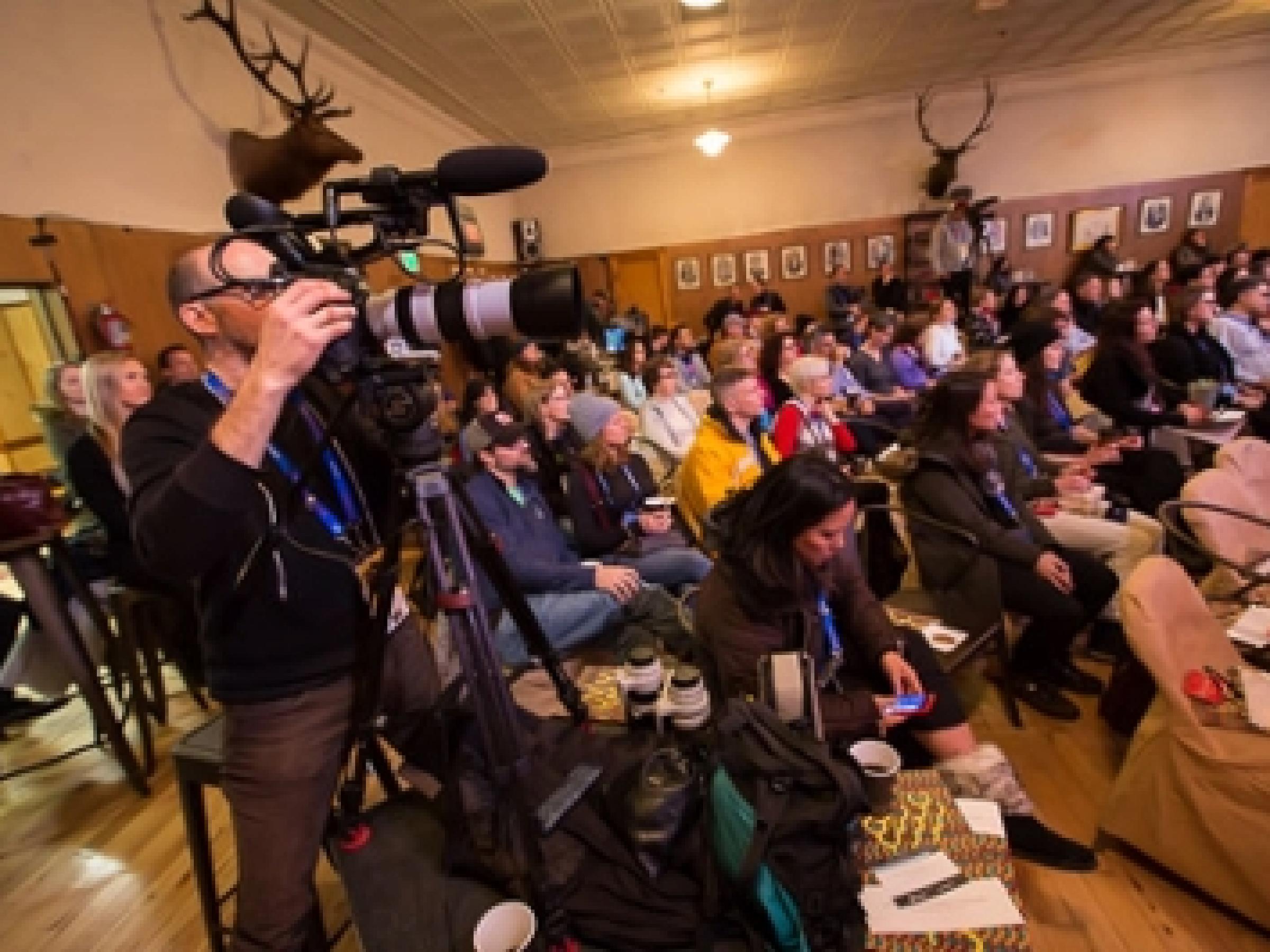 Panel audience including photographers