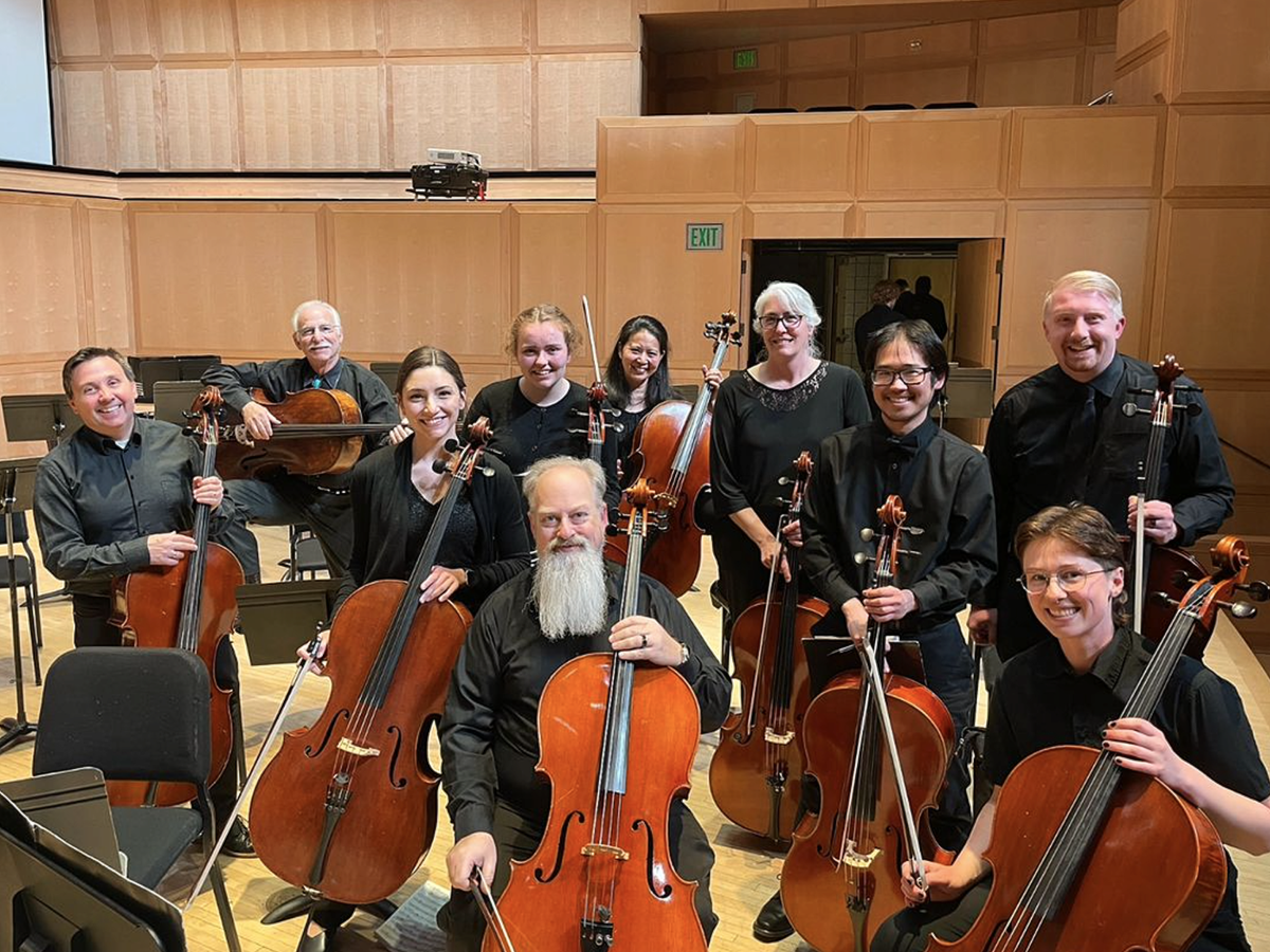 A group of musicians sitting together for a photo.