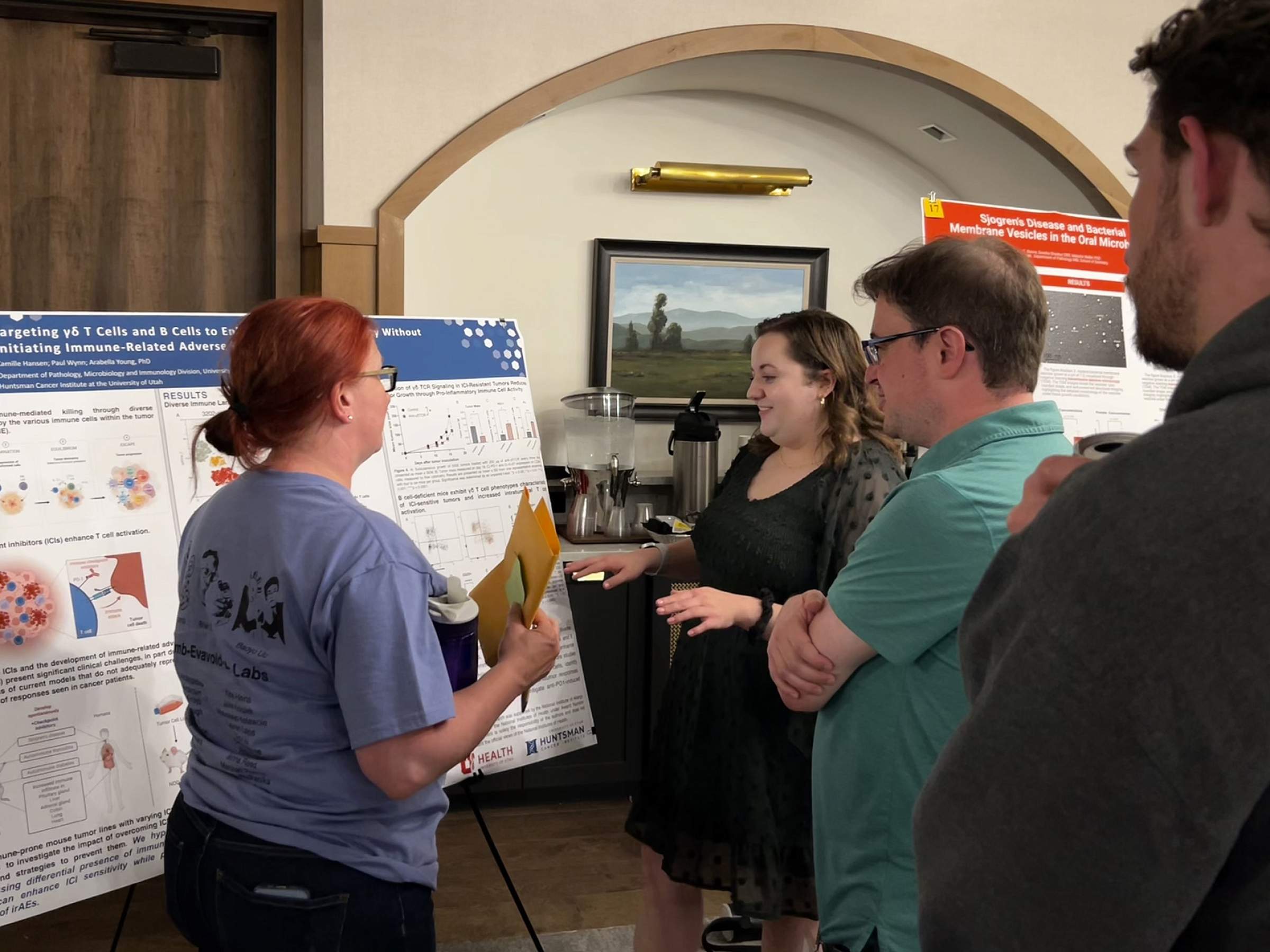 Young Lab member Camille presenting a poster at a research retreat