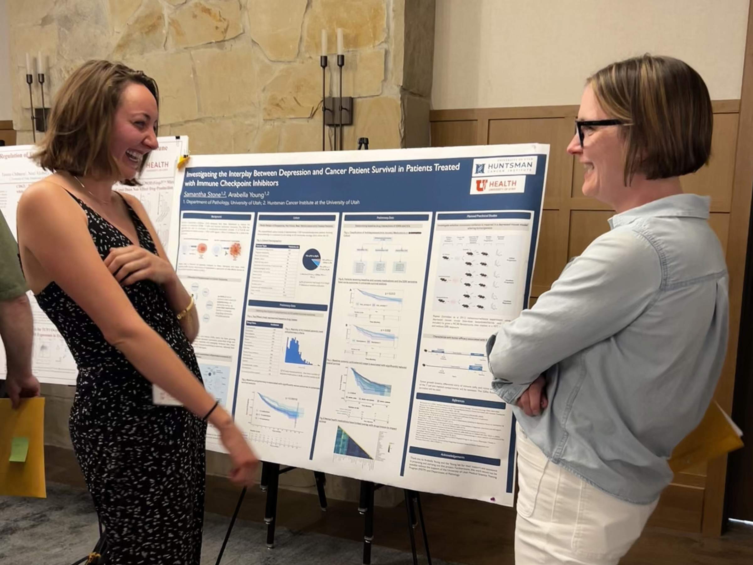 Young Lab member Sammy presenting a poster at a research retreat