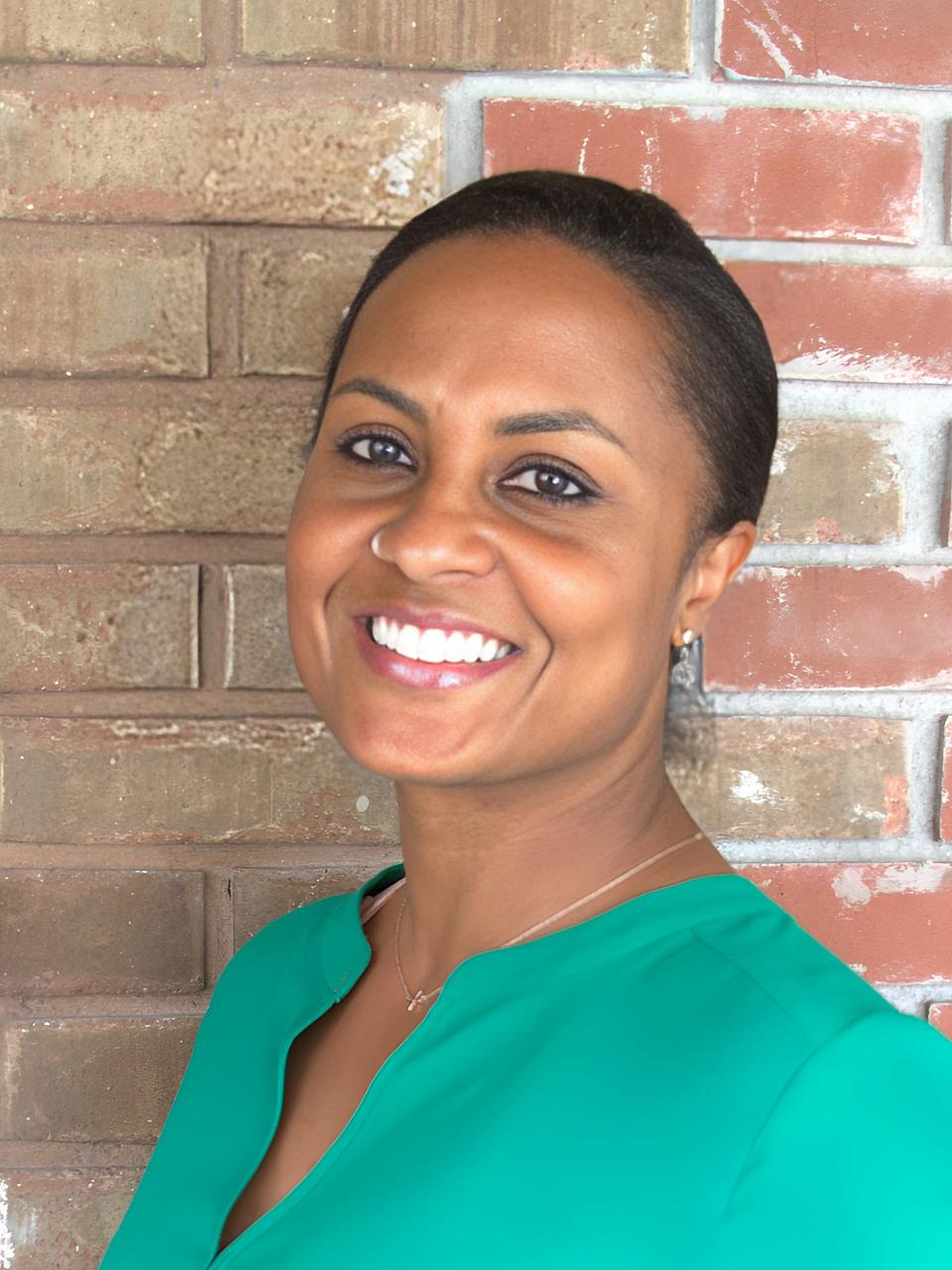 A headshot image of Ashley Foster-Kelley