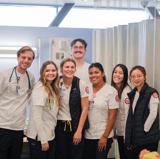 a group of nursing students smile