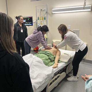March Saturday Academy student practices CPR in the simulation environment