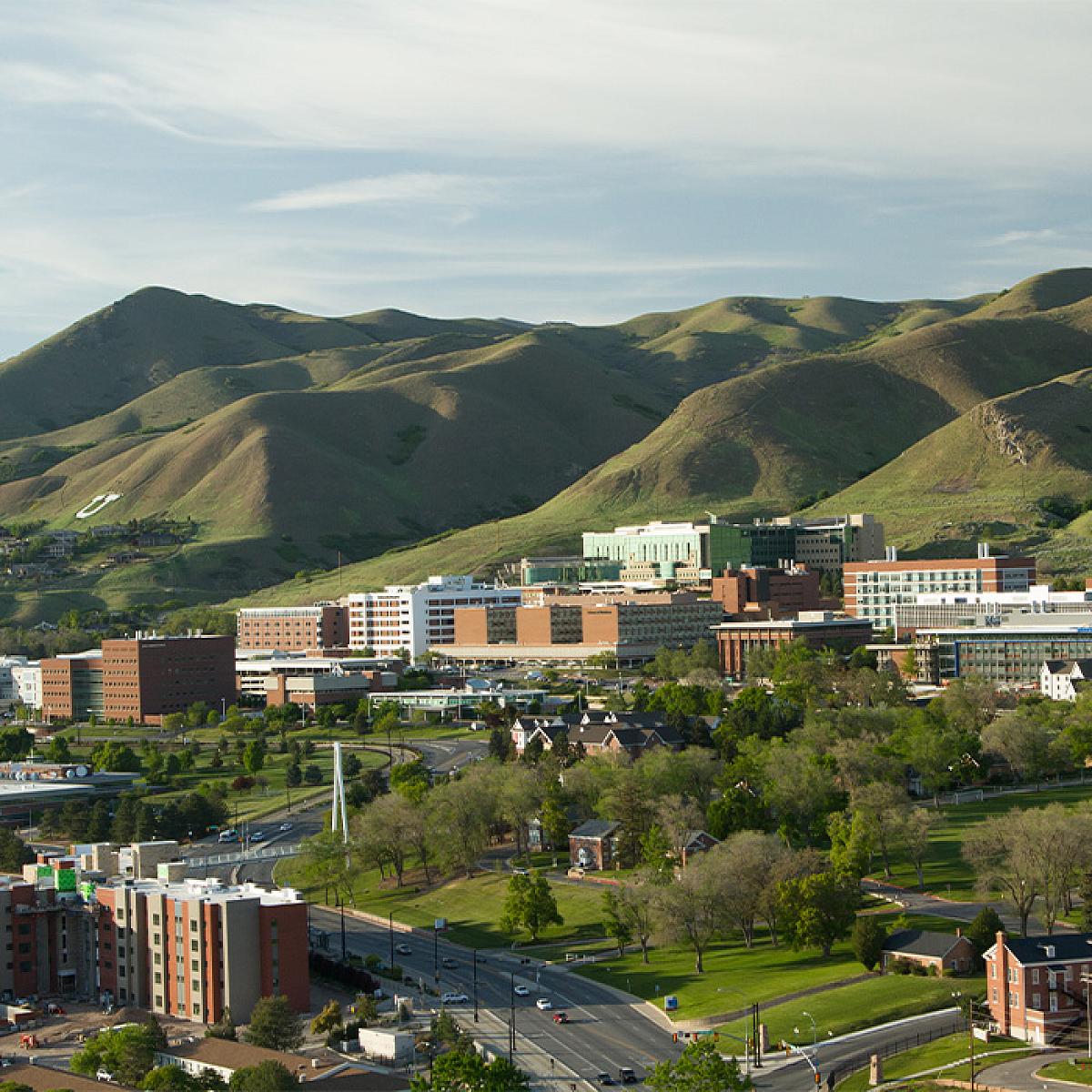 Aerial View of Campus with Buildings and Mountains