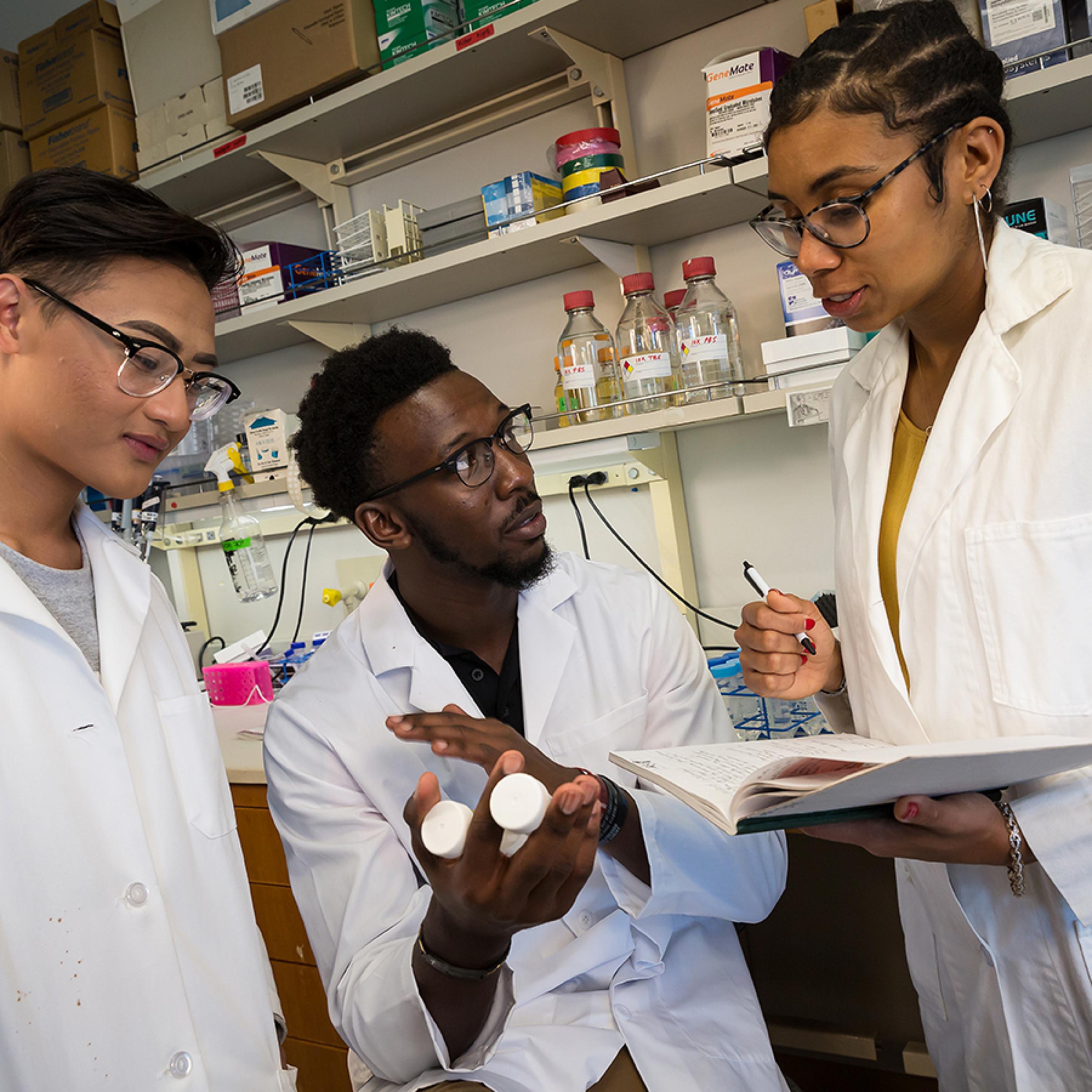 Postdoc Researchers in Lab Coats in Research Lab