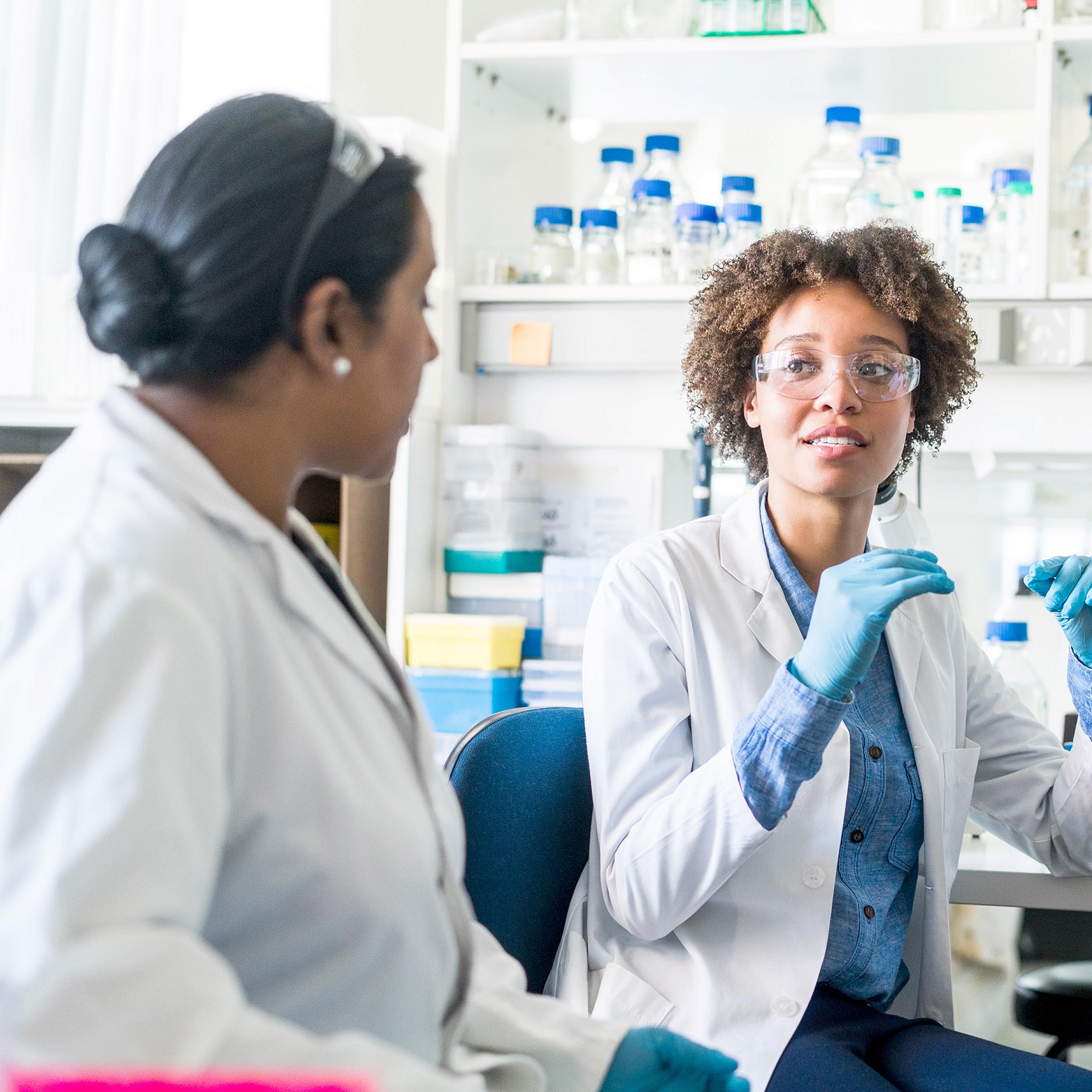 Two women of color in a research lab