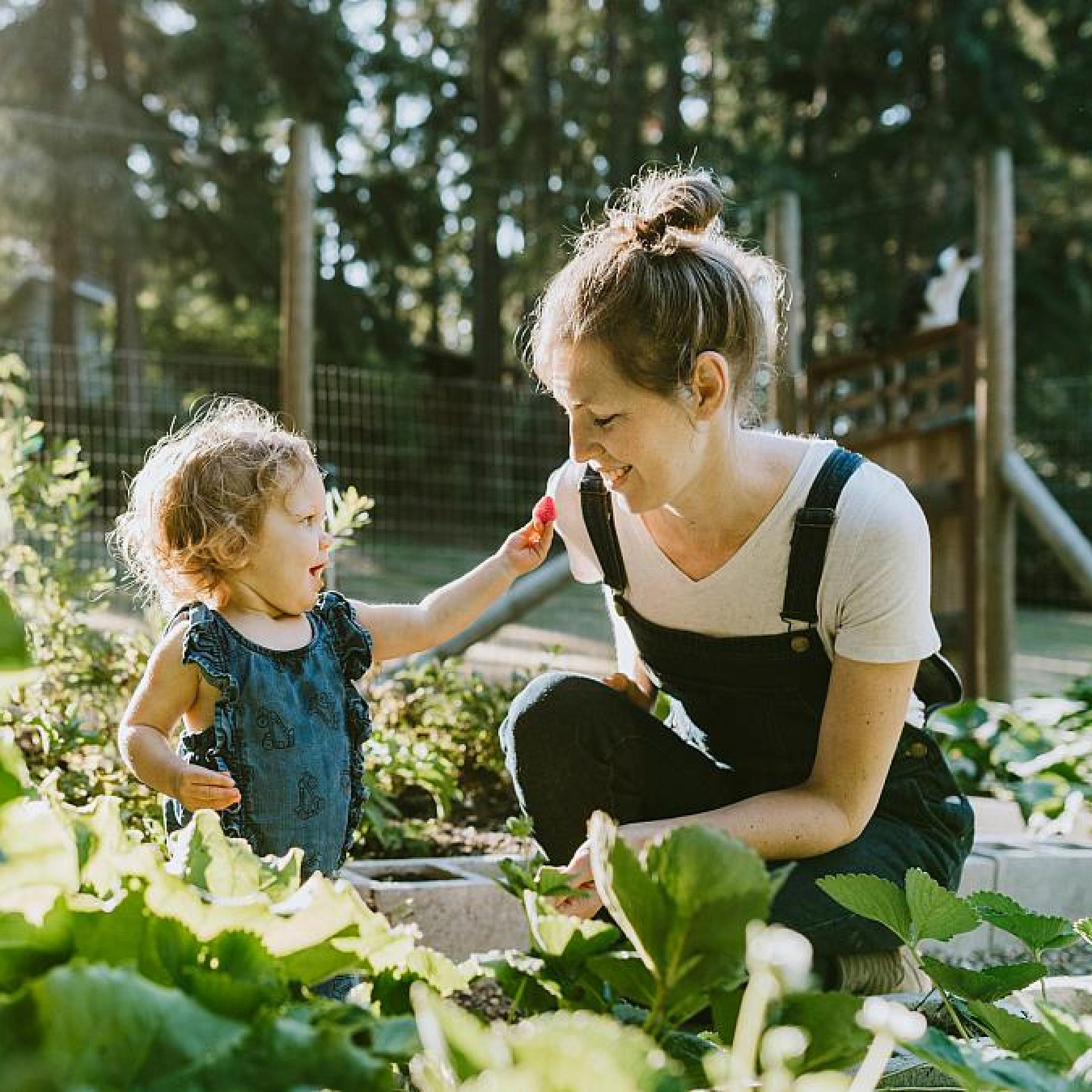 Parent and child in a garden 