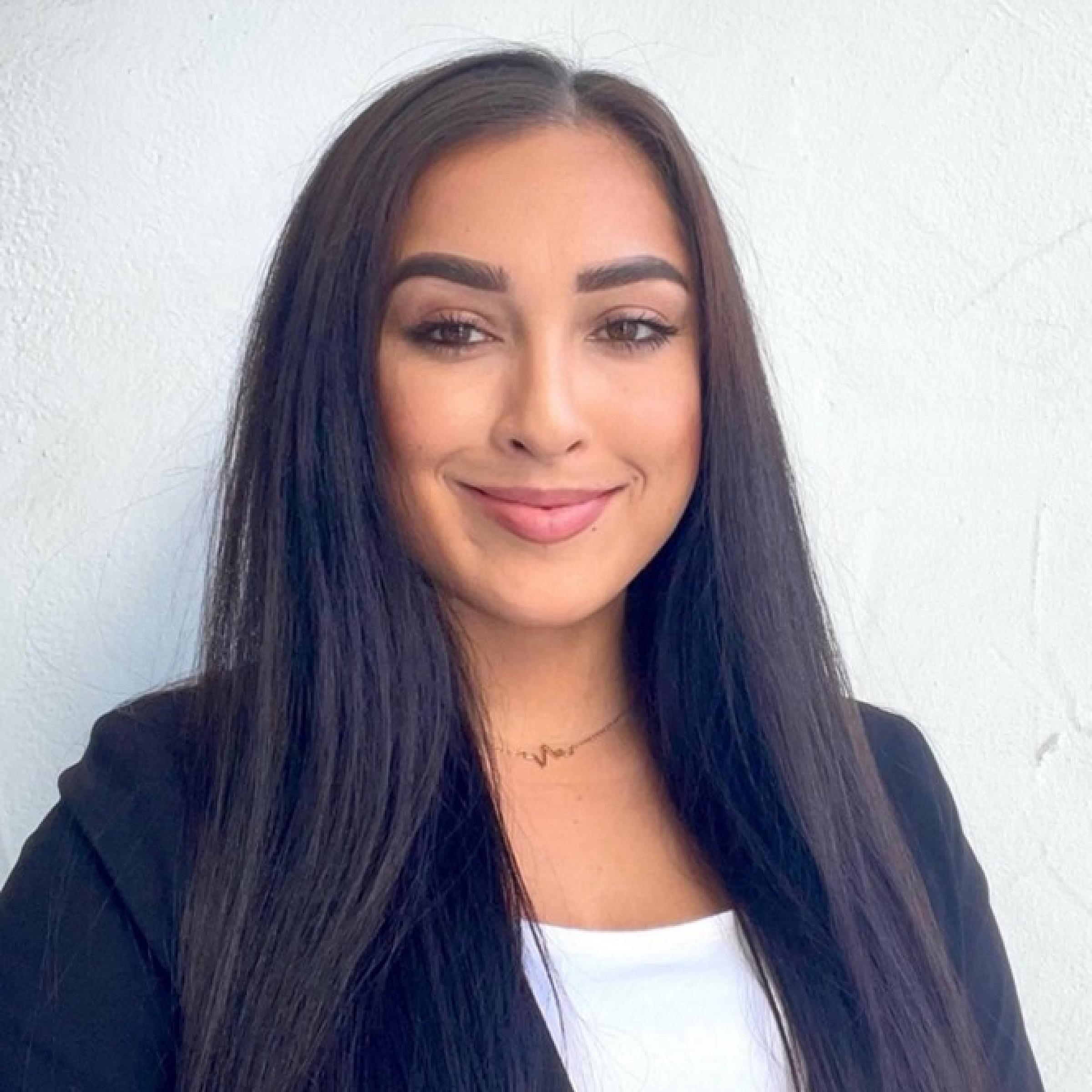 portrait of Odyssey Contreras in a blazer