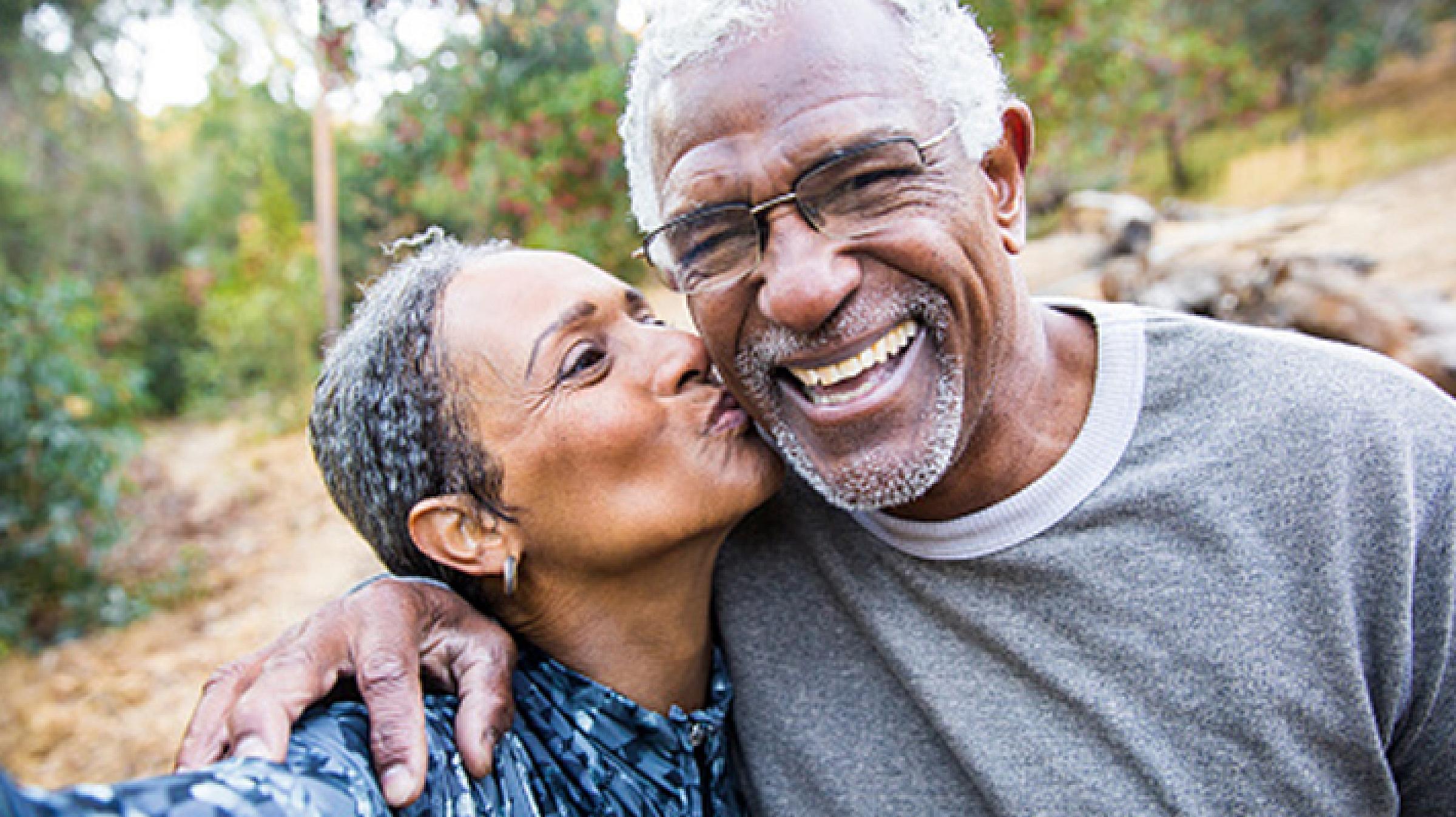 Older Couple Smiling and Kissing