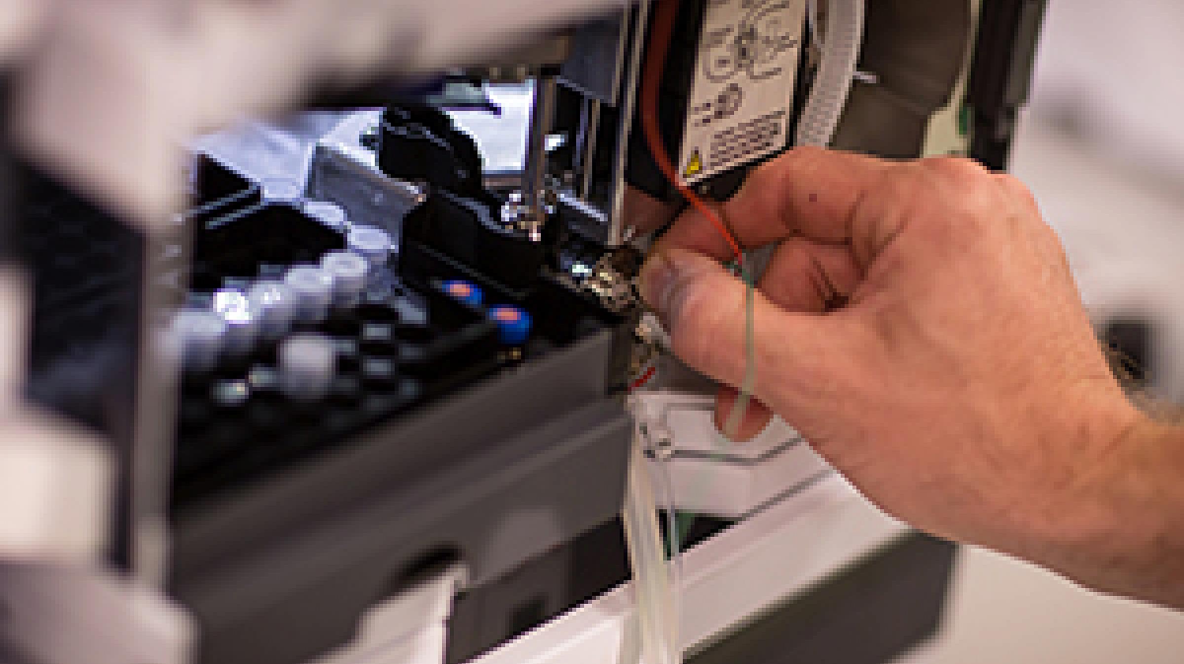 Hand at a machine